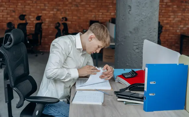 Invoices being scanned at an office desk