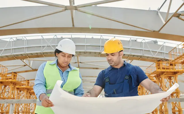 Construction worker wearing a safety helmet on site