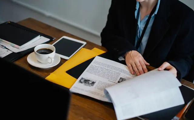Underwriter reviewing documents at a desk