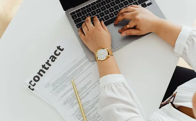 Typing a legal document on a laptop