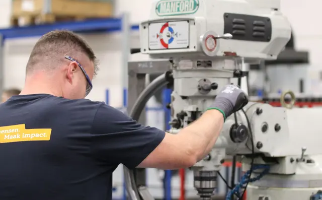 Maintenance engineer working on an industrial machine