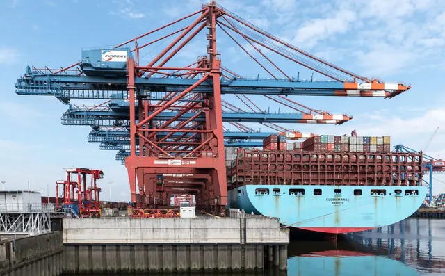 Gantry crane loading containers at a terminal