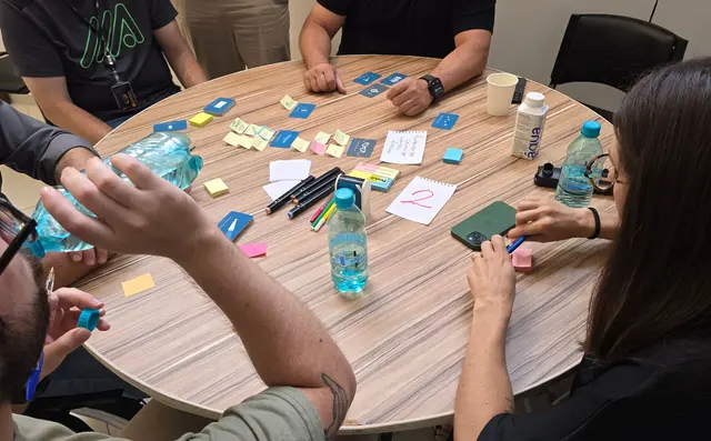Marketing team working with sticky notes on a wall