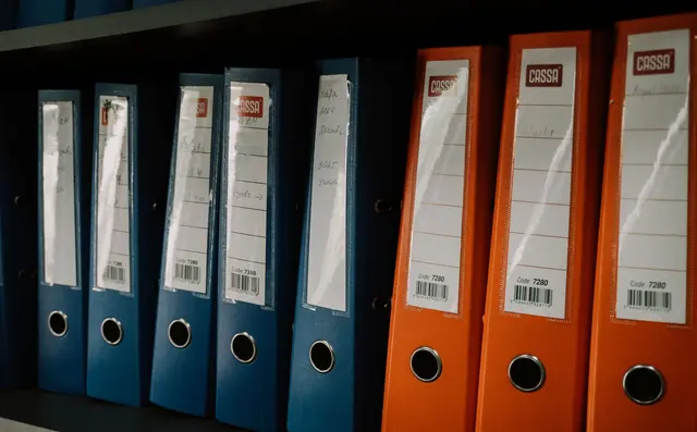 Regulatory documents and binders in an office