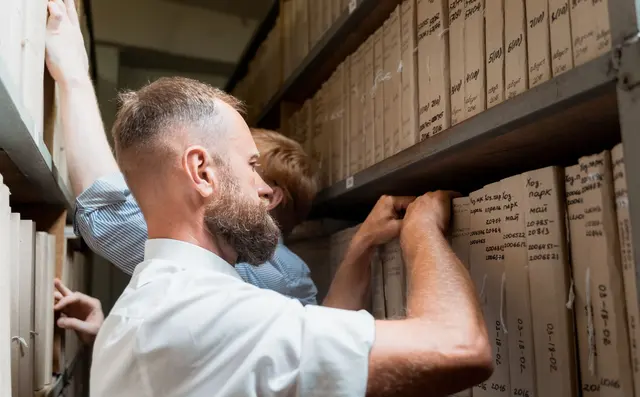 Public records archive with shelves of files