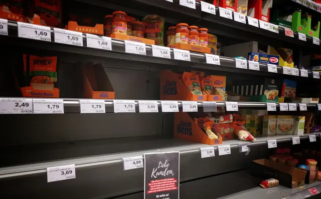 Well-stocked supermarket shelves