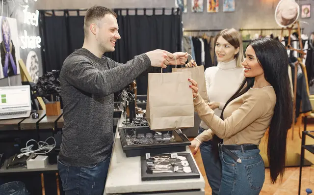 Shop assistant helping a customer at the counter