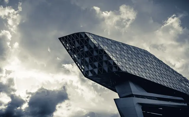 The Port House in Antwerp against a cloudy sky