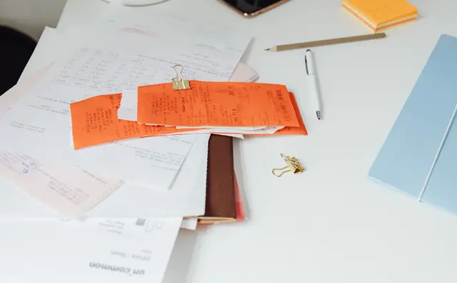 Paper forms and documents on a desk