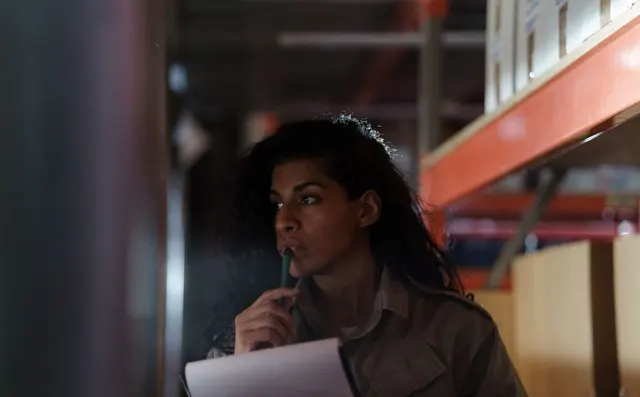 A worker planning in the warehouse