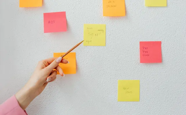 Coloured sticky notes on a wall during planning