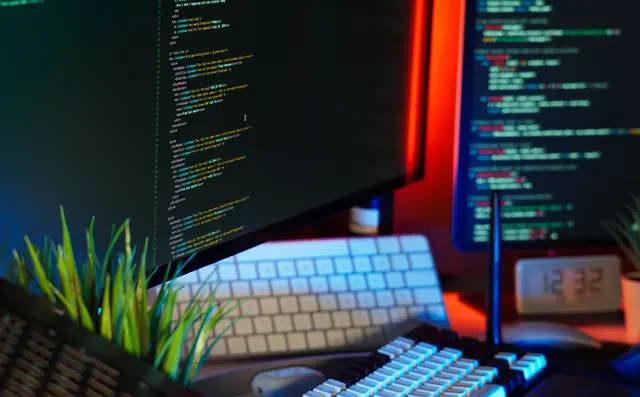 Code open on a monitor at a desk
