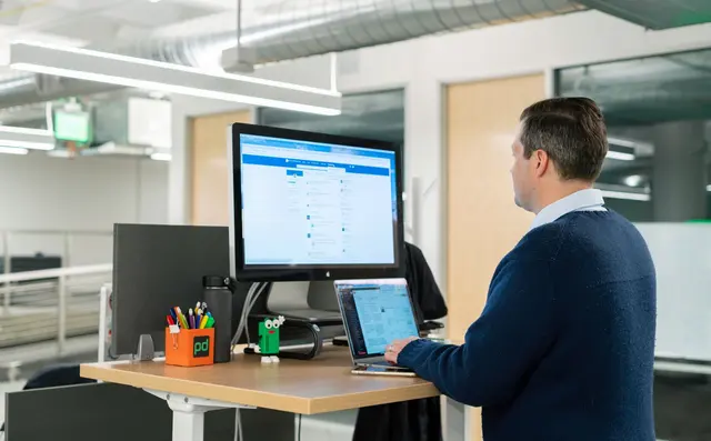 An office worker using an application at a desktop