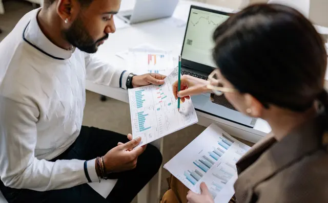 Two colleagues going through analytics together