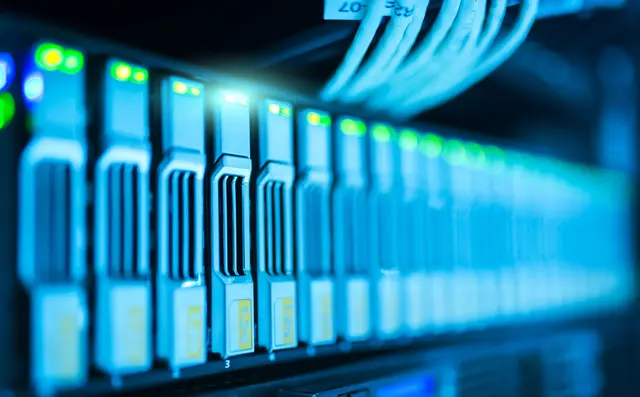 Server racks in a data centre with blue indicator lights