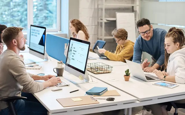 Developers working side by side in an open office