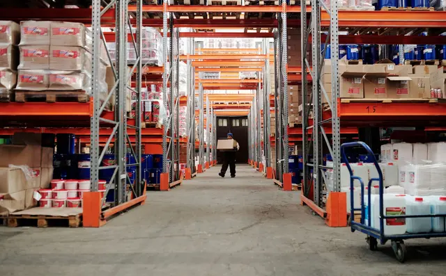 An aisle of pallet racking filled with stock